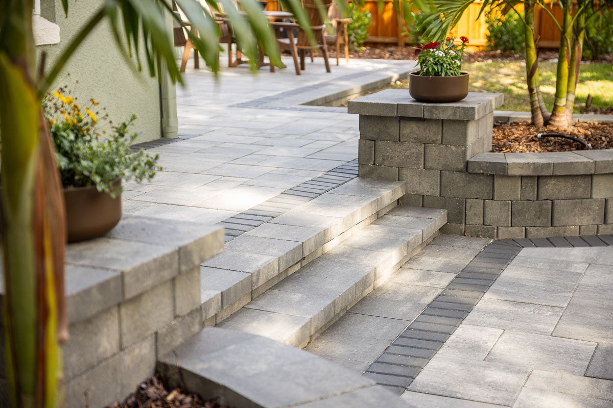 hardscape stairs raised planting bed paver patio and container plants