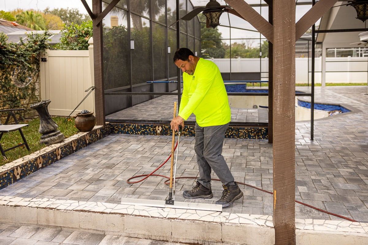 maintenance crew paver sealing slab patio 13