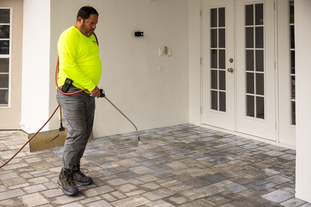 maintenance crew paver sealing slab patio 2