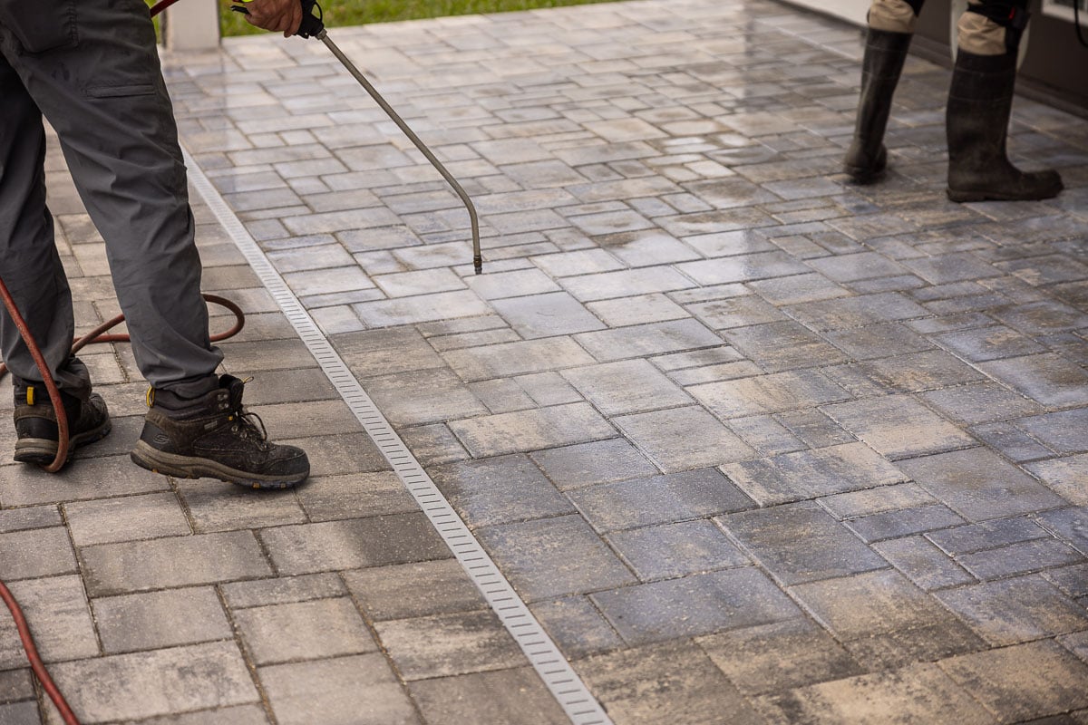 maintenance crew paver sealing slab patio 5