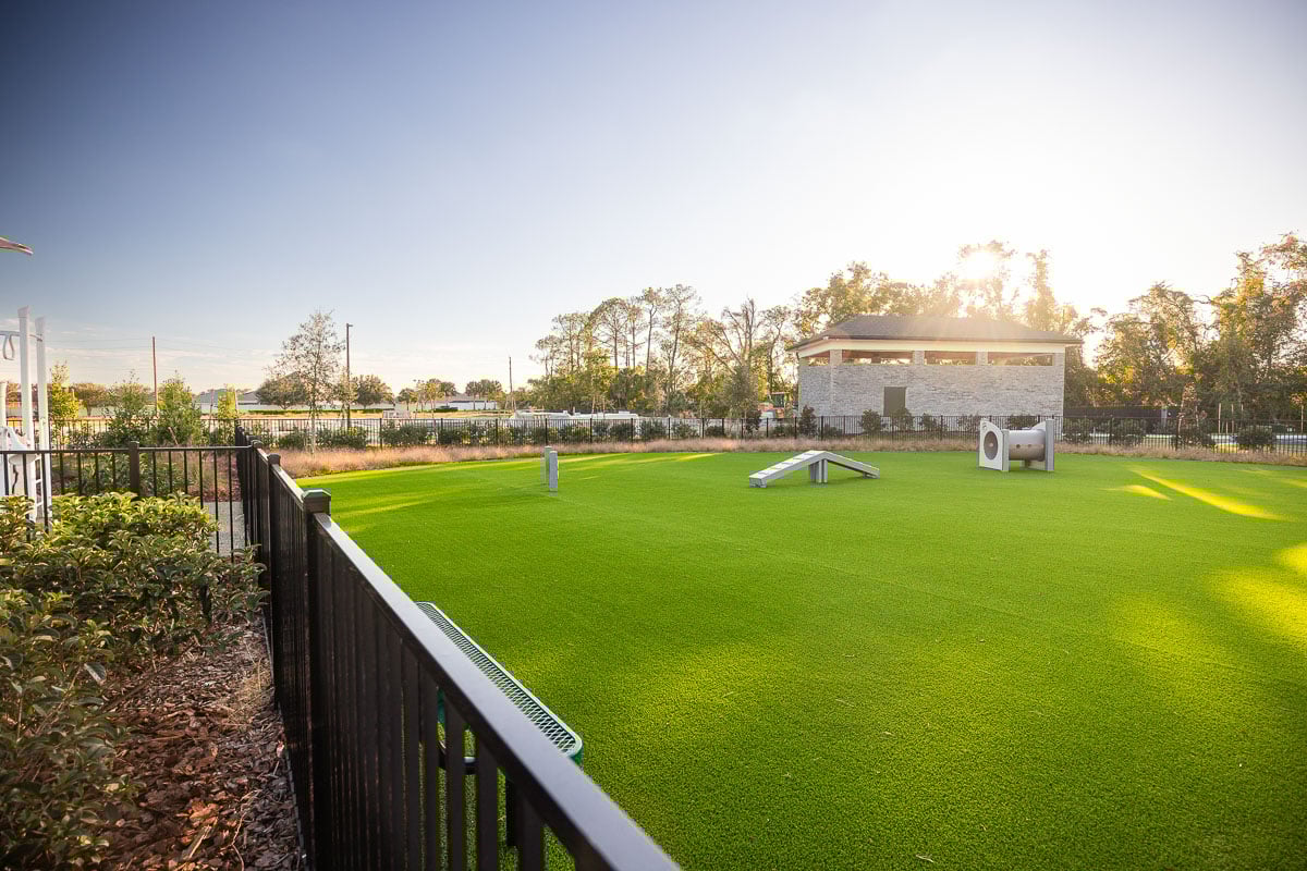 commercial apartments artificial turf fence planting beds dog run
