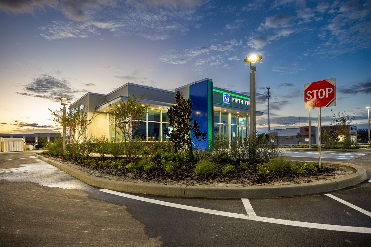 commercial business park retail night landscape lighting sod plants 9