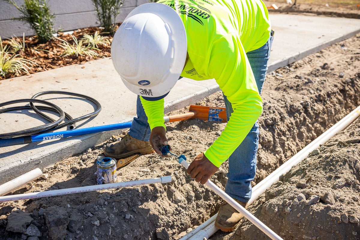 commercial construction irrigation installation warehouse industrial crew team 11