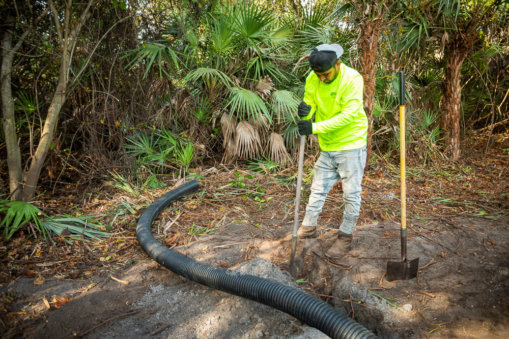 crew digging trench for drainage