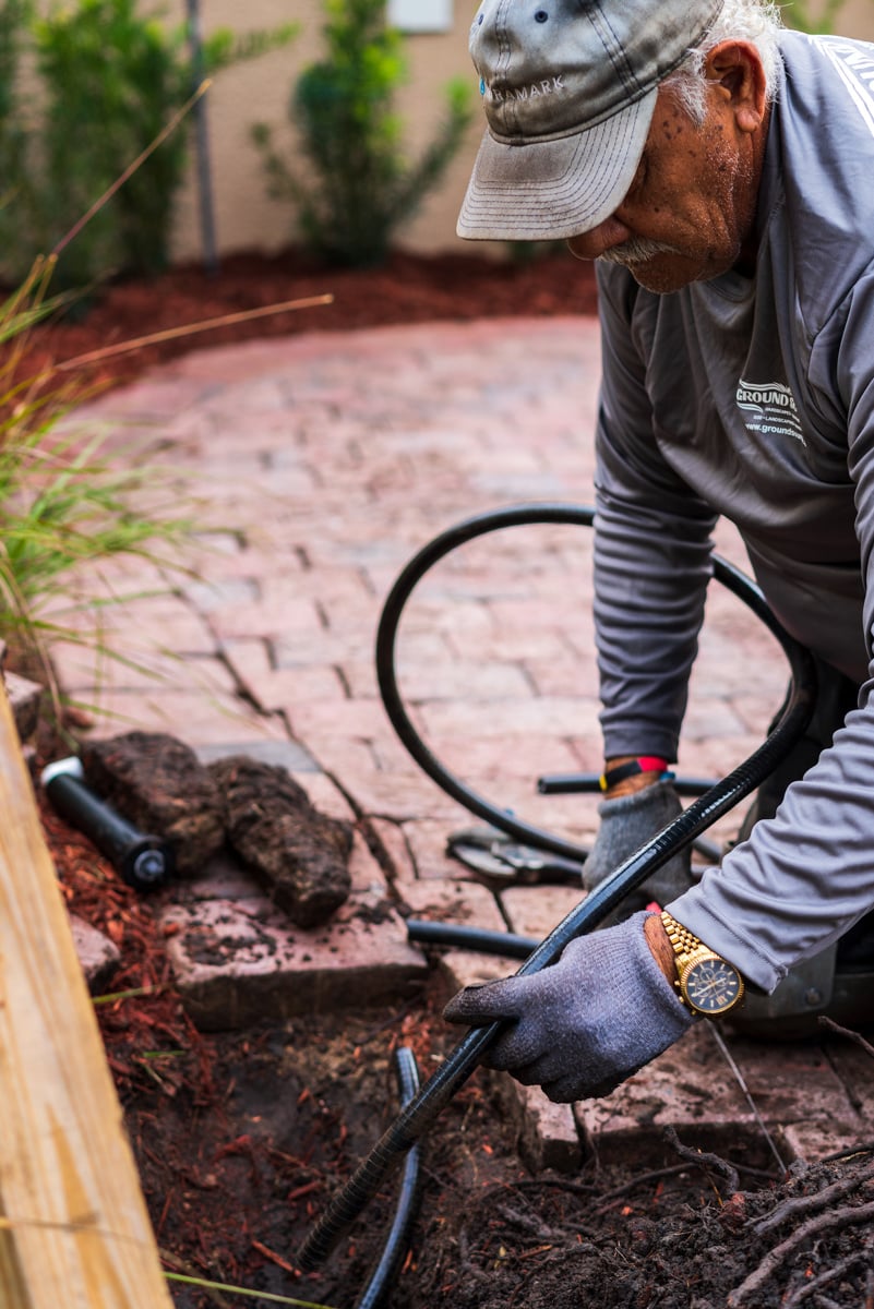 irrigation installation near paver patio