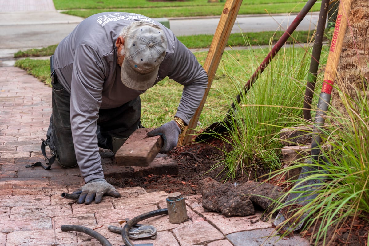 irrigation team repairs sprinkler system