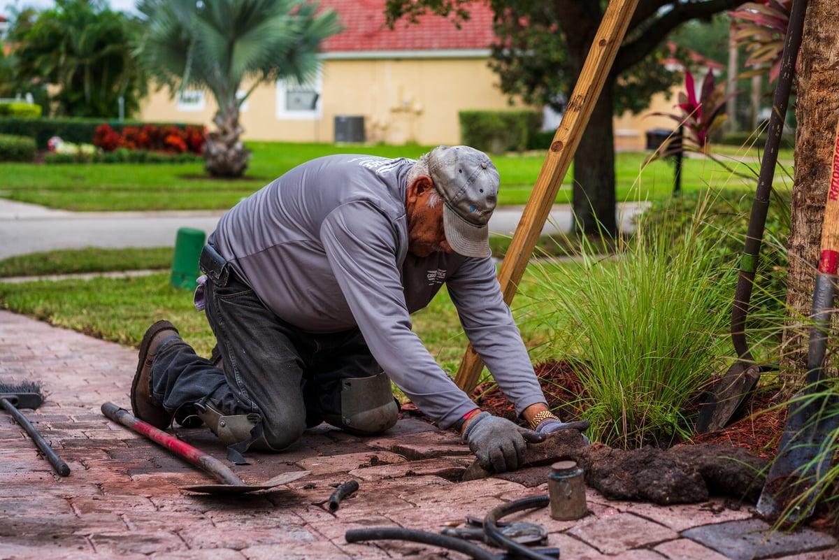 irrigation team repairs sprinkler system