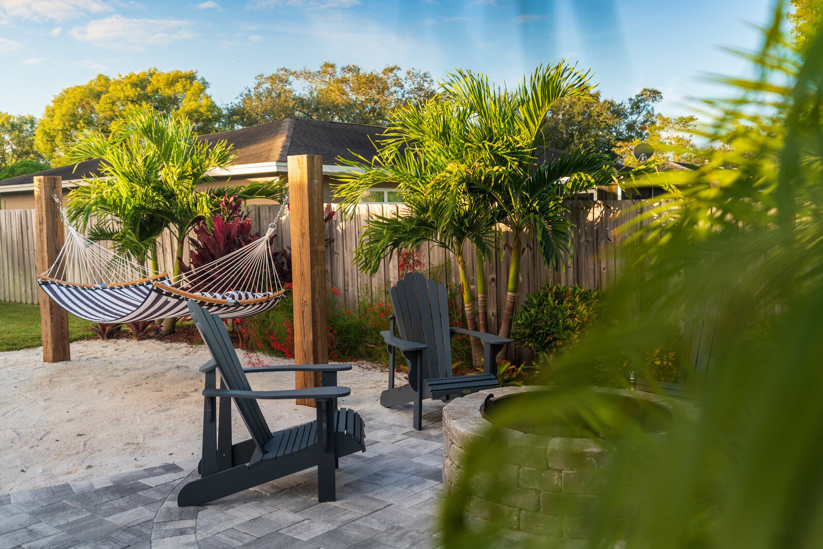 hammock sand lawn planting paver patio fire pit
