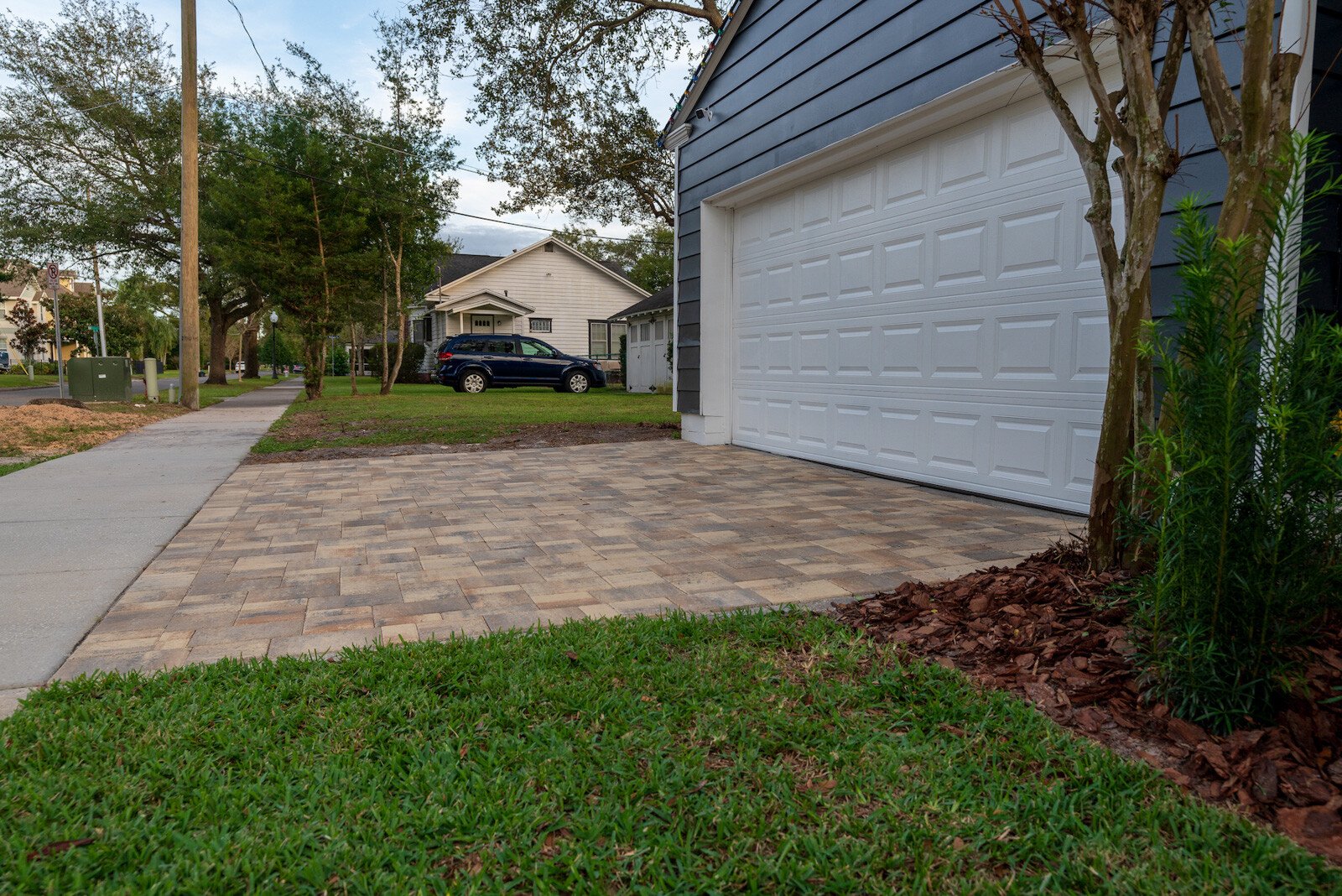 Sloping driveway away from the house