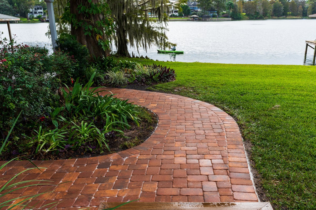 paver walkway near water