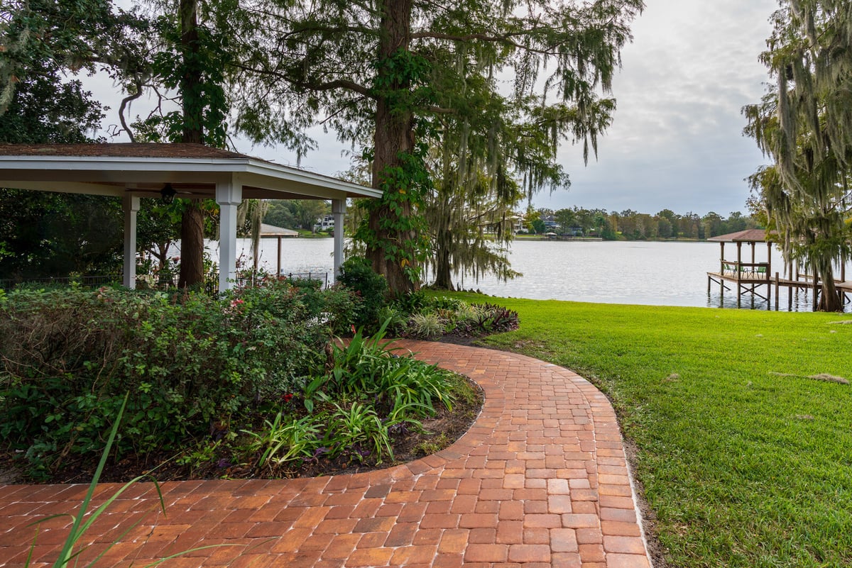 brick walkway near water