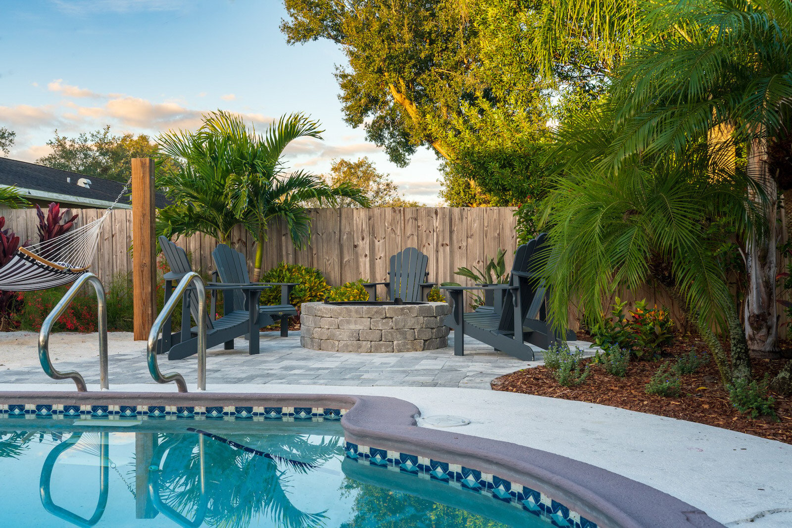 Petite palms for pool landscape installation