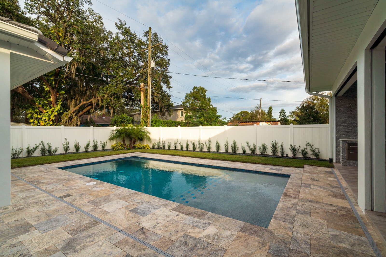 Natural stone pavers around a pool