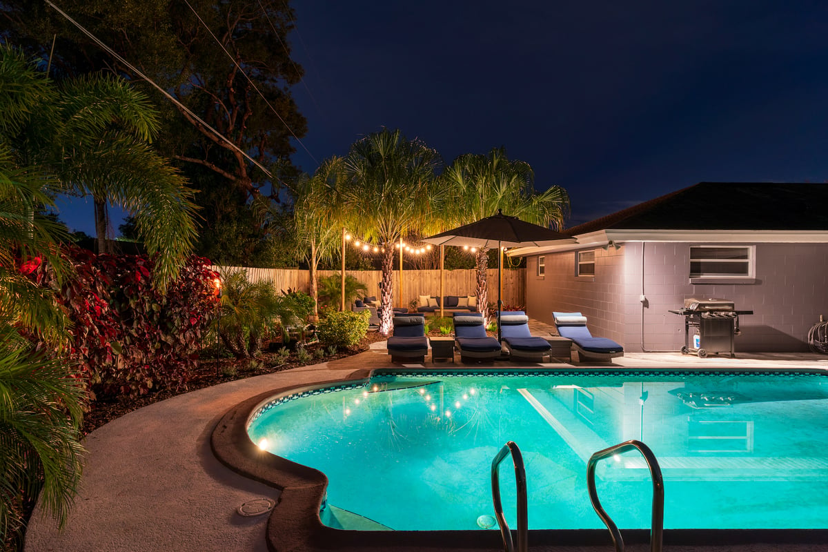 landscape lighting near pool and home 