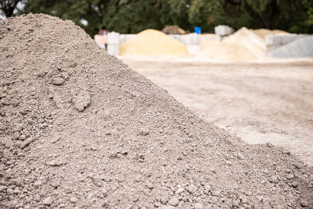 a pile of paver base material in a florida landscape facility