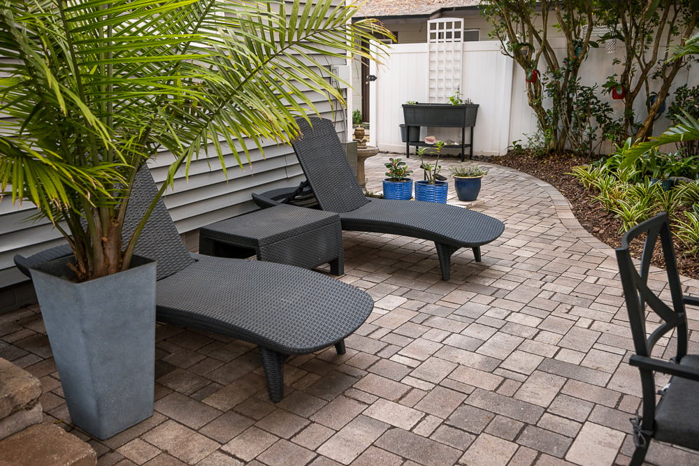 patio furniture and potted plants on backyard patio