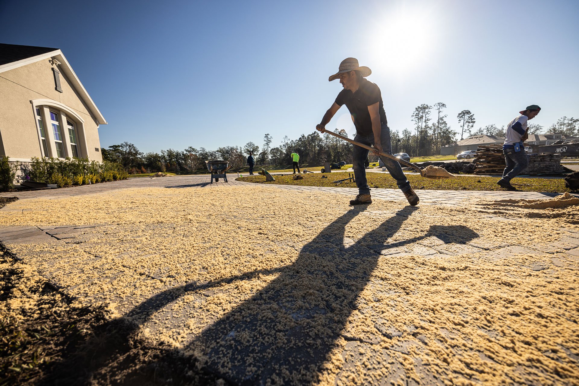 driveway construction fox crew paver top joint sand 1