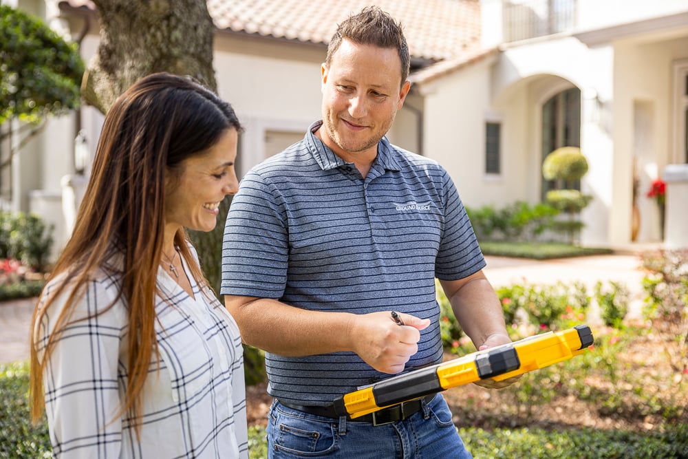 irrigation company and customer reviewing proposal