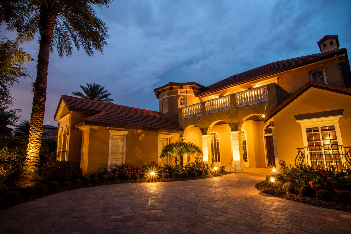 entrance of home with landscape lighting