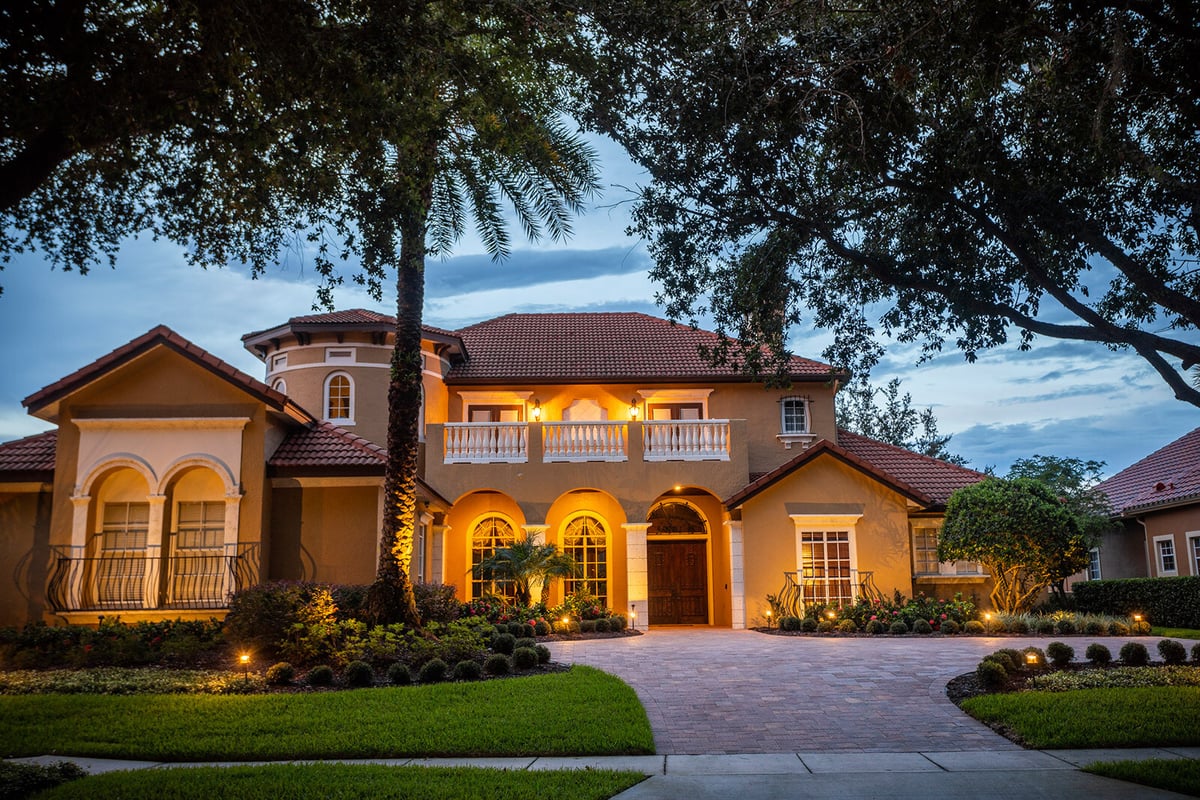 landscape lighting at front of home near windows and doors