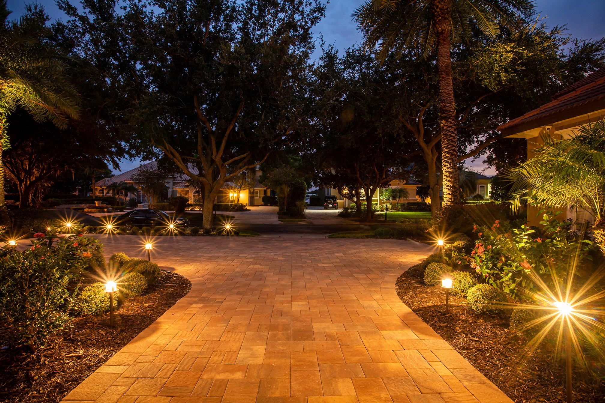 Paver driveway with landscape lighting
