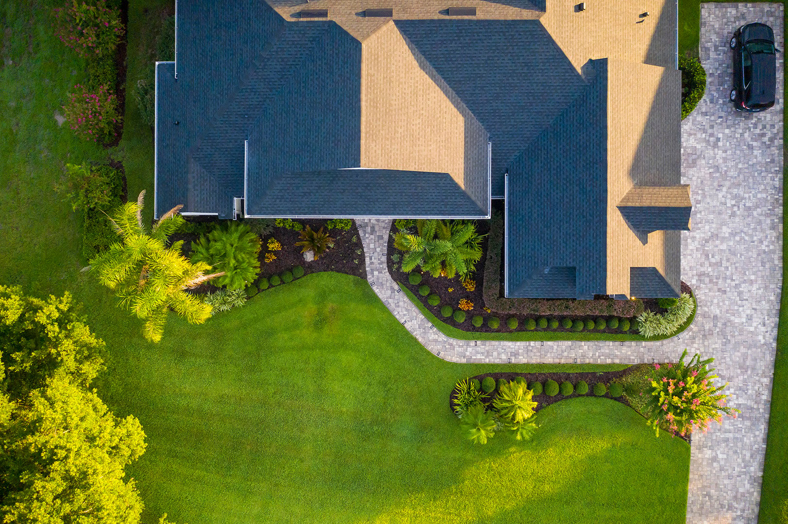 Aerial of paver pathway, driveway and plantings