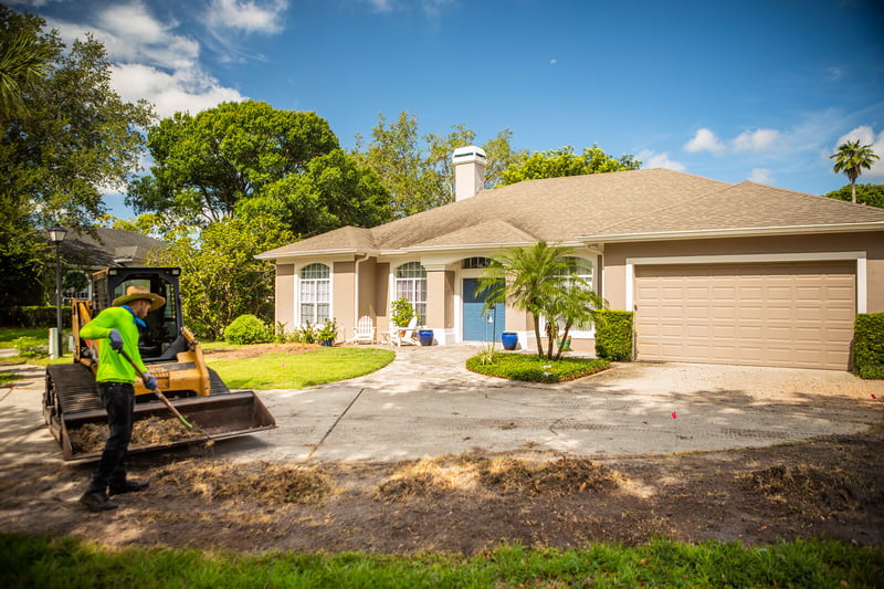 technician preparing lawn for sod installation