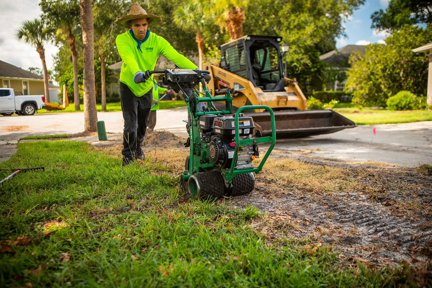 Lawn team removing dead sod to install new sod