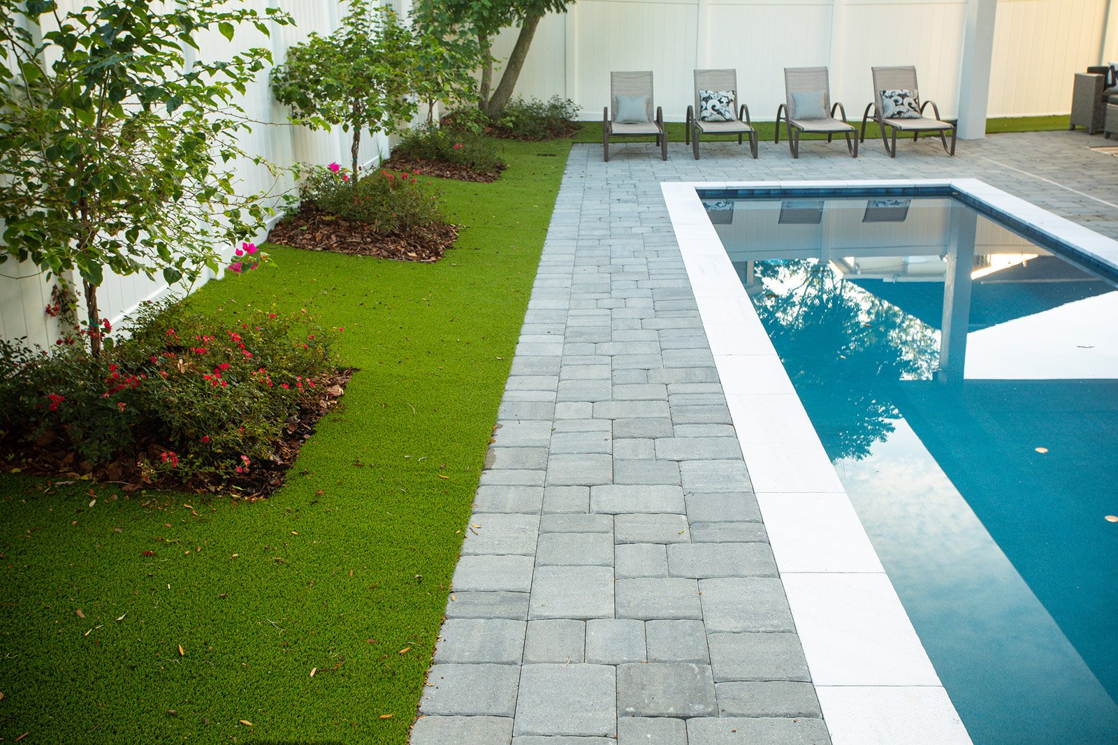 Mulching landscaping beds around a pool