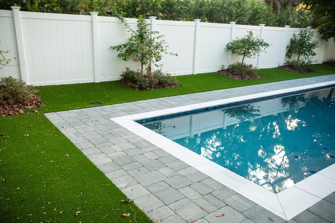 Pool surrounded by artificial turf