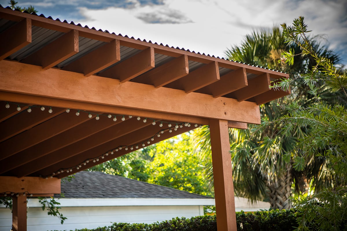 pergola with landscape lighting and plantings