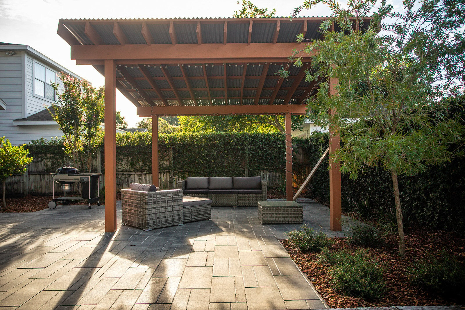 Paver patio with a pergola