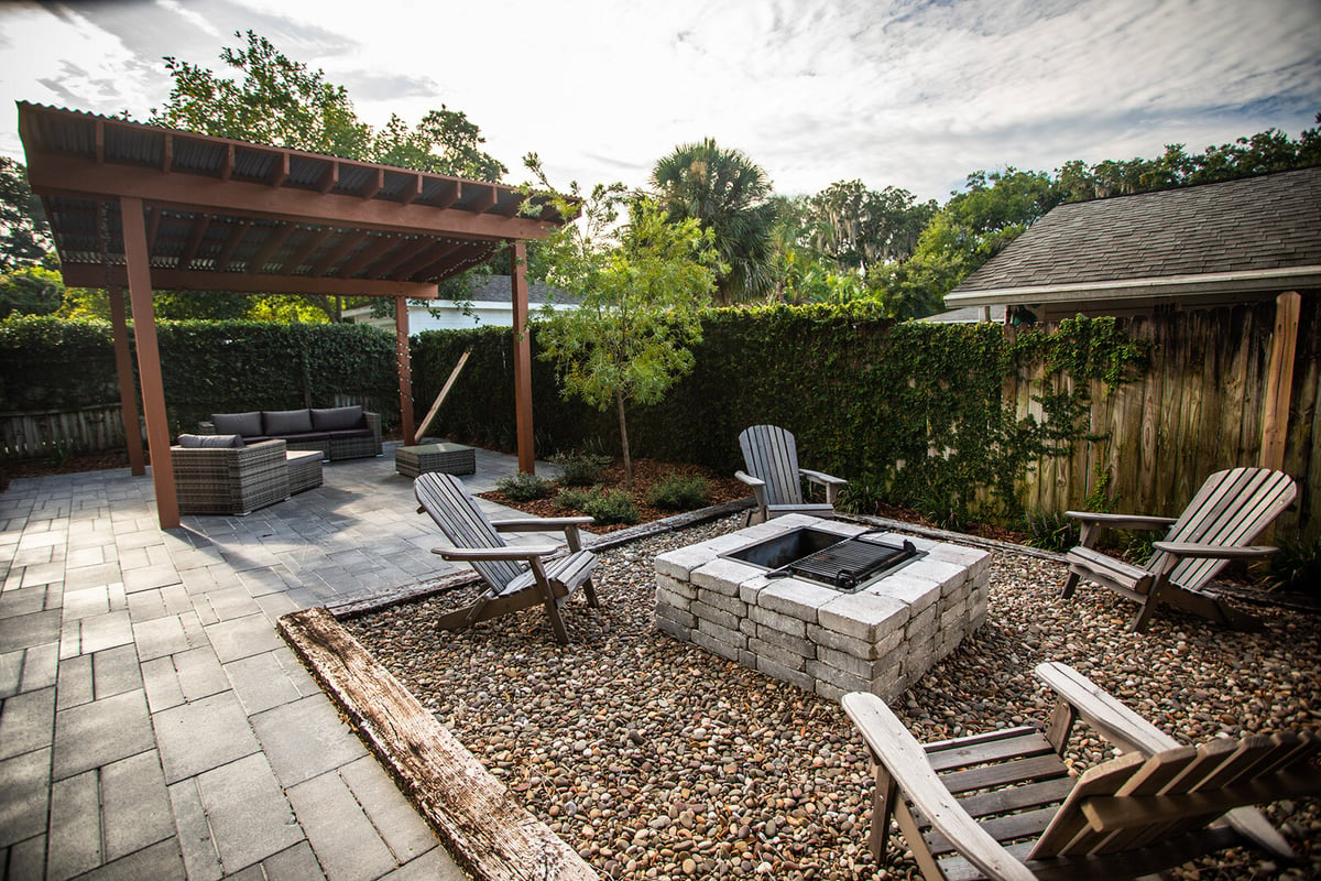 pergola with patio and firepit in small backyard