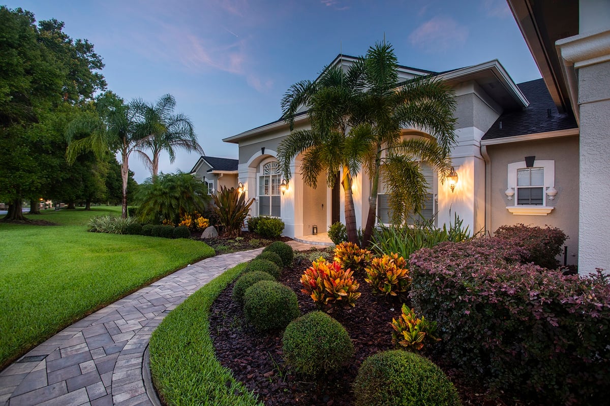 neat landscape with queen palms