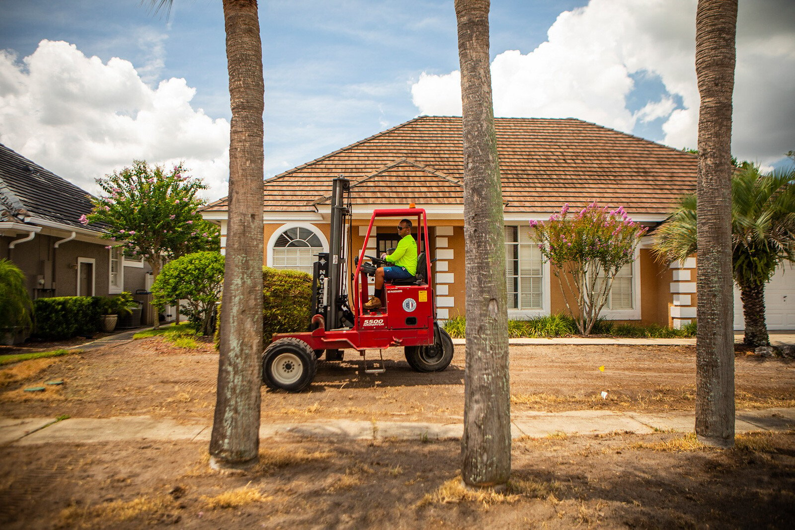 Lanscape installation team moving around sod