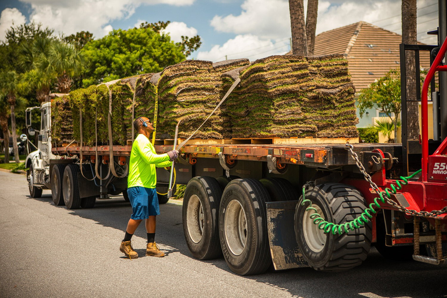 Ground Source Lawn Crew unloading sod to be installed