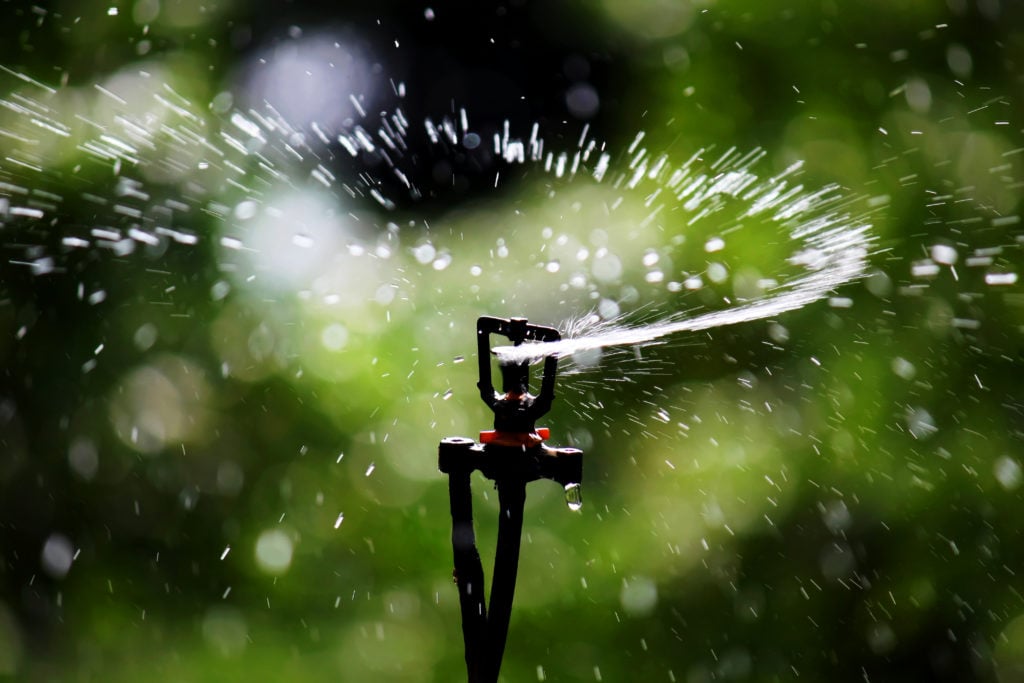 Irrigation left in lawn to cool down artificial turf