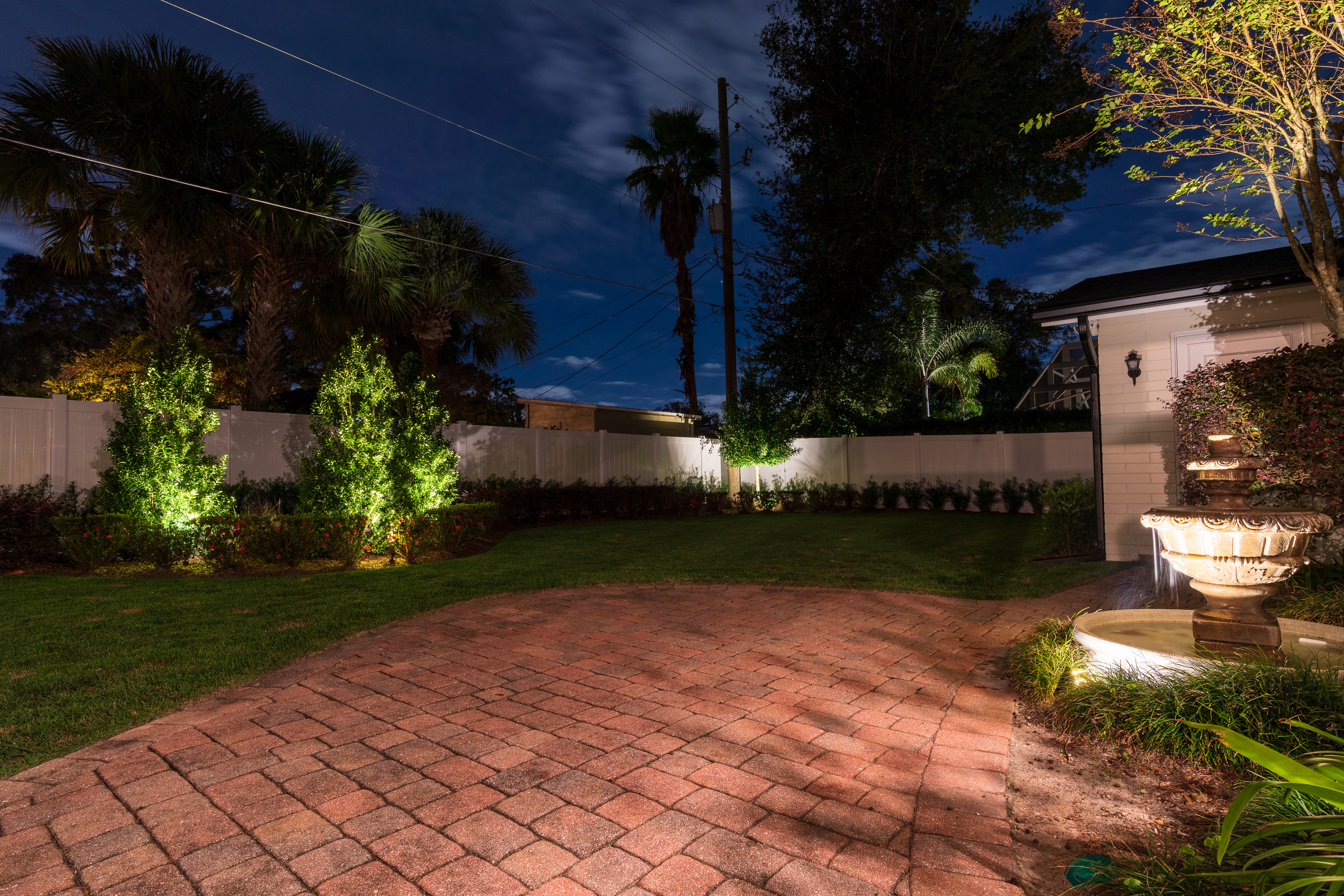 landscape lighting on patio and trees