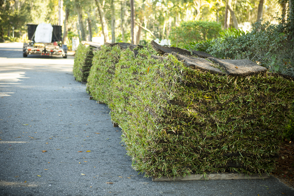 stacks of sod being delivered