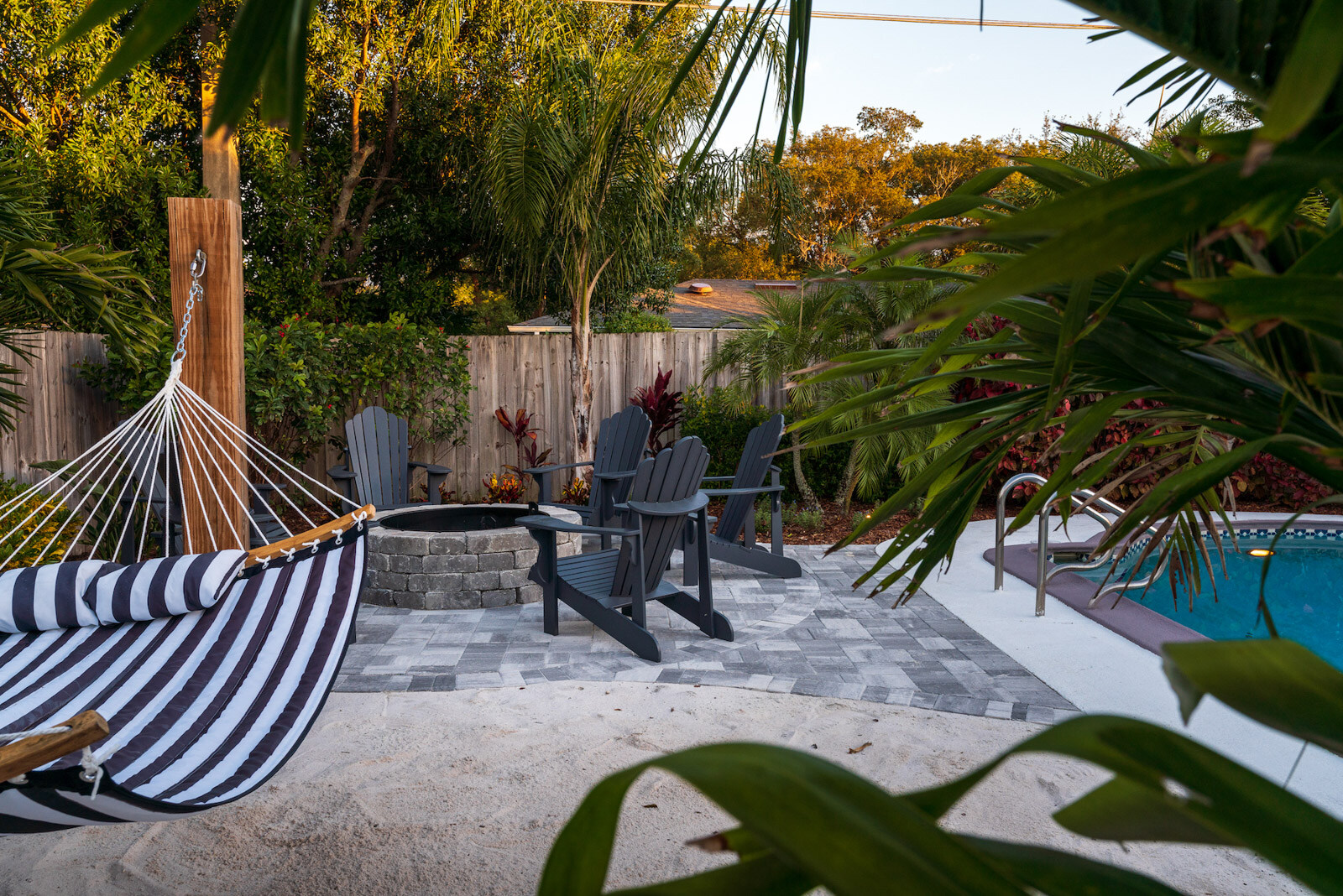 Backyard hammock, pool and fire pit for relaxing