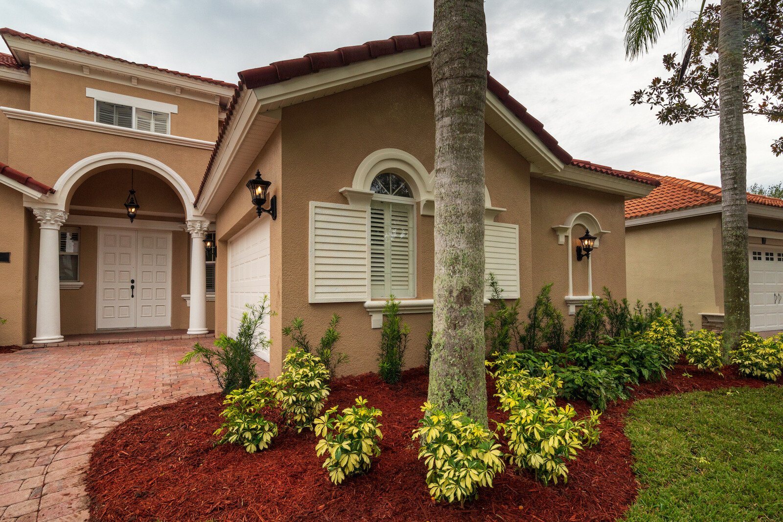 home with mulch and plantings in landscape beds