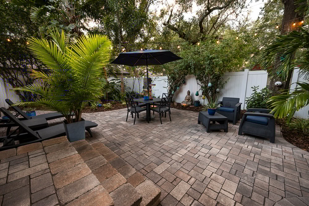 patio with planter pots and tropical plants