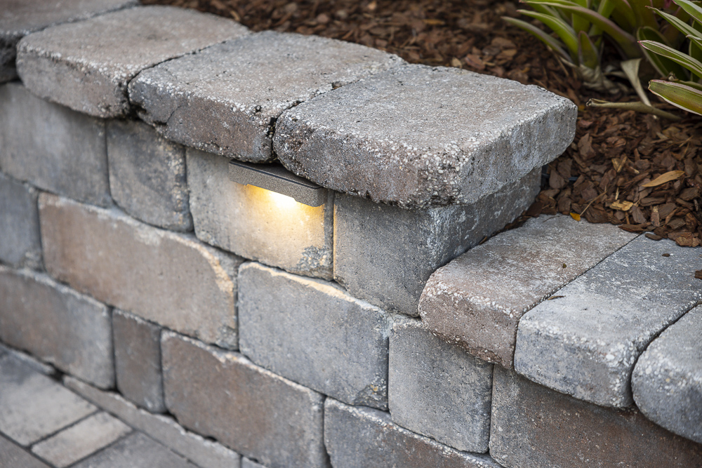 retaining wall close up with built in landscape lighting