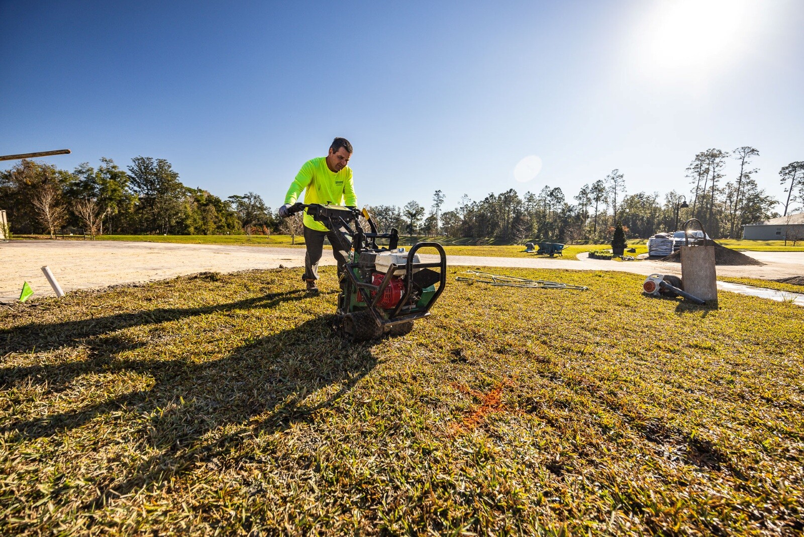 landscape technician with sod cutter